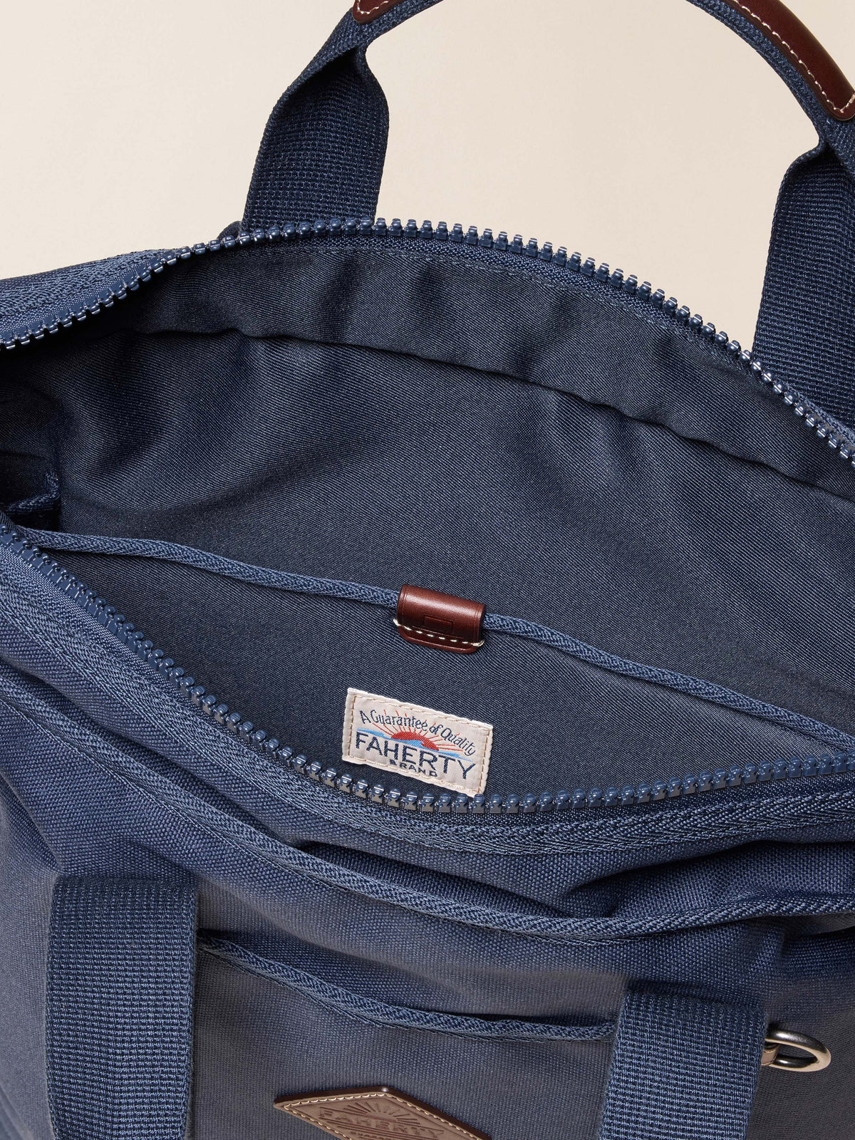 FA25-Faherty-Unisex-UAF2302-NVY-LAYDOWN-LATITUDETOTEBACKPACK-Navy_DETAIL_2_Web.jpg
