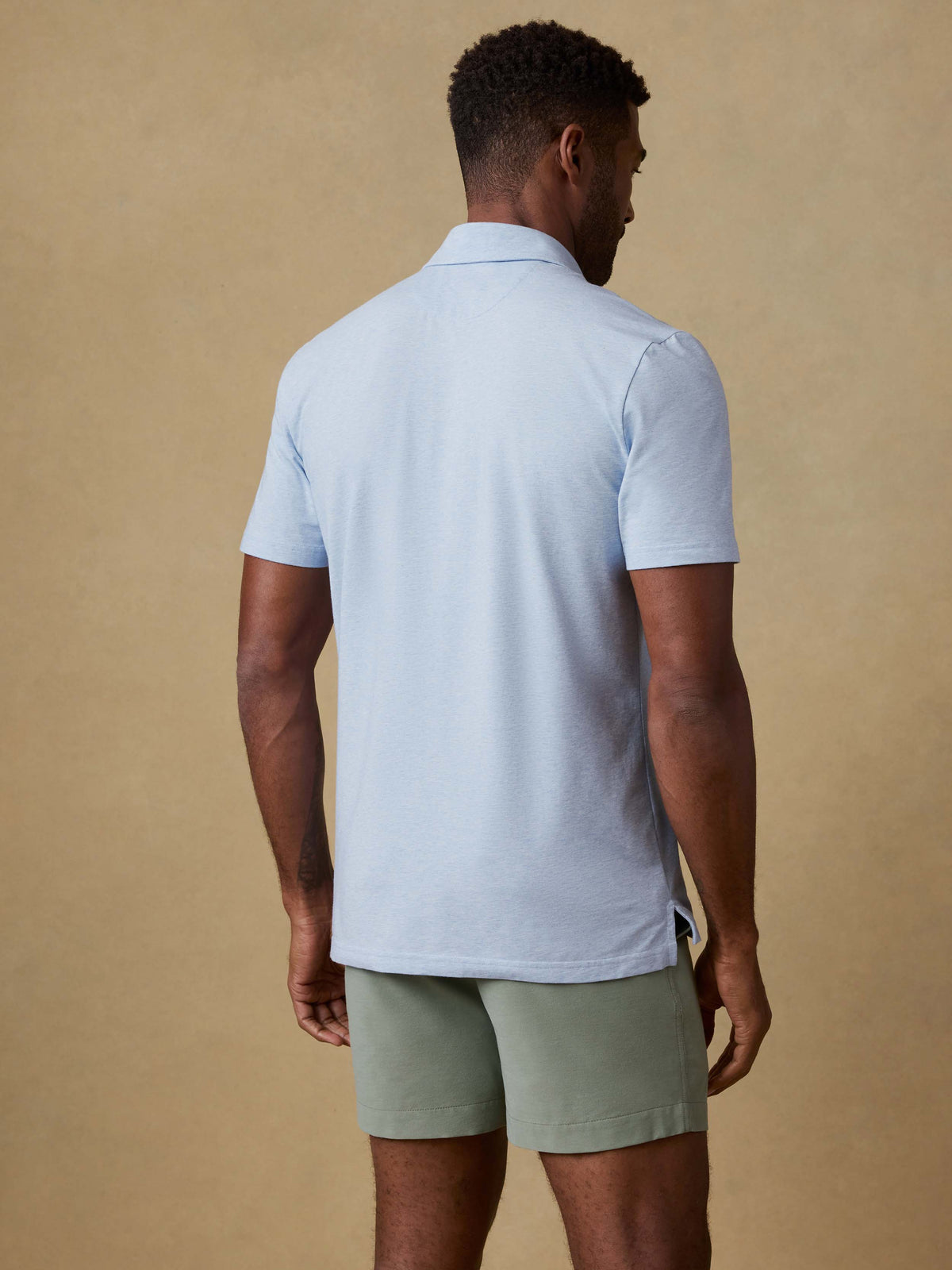 SP26-Faherty-Mens-MKS2425-CDB-Ss_Movement_Polo-Cardiff_Blue_Heather_OM_BACK_CROP_1_Web.jpg